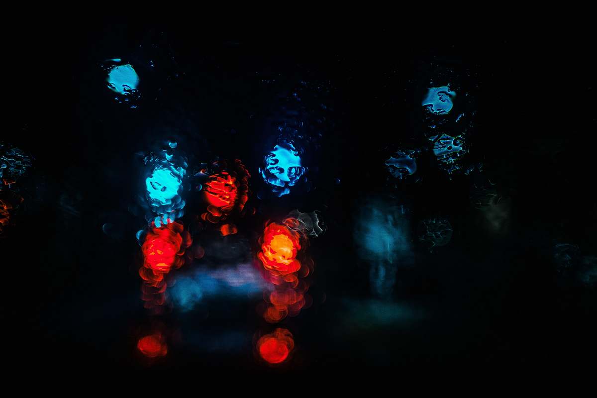 light bokey photography of red and blue light dark