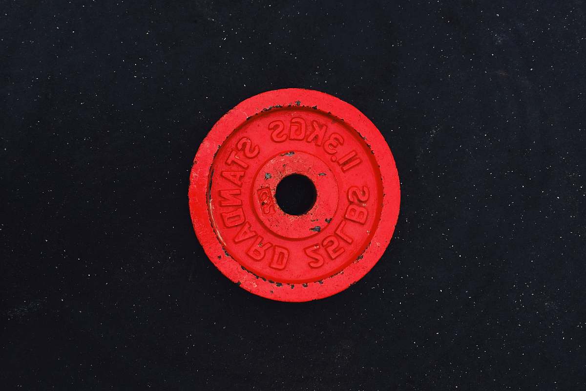 symbol 11.3 kgs red barbell plate trademark