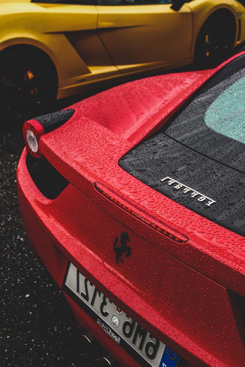 spoke red Ferrari sports car with licence plate number 6M63127 wheel