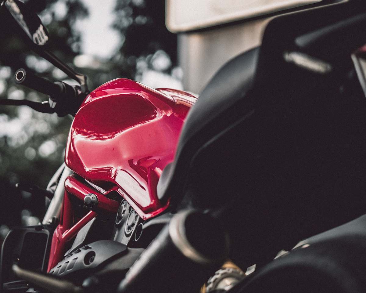 transportation red and black sports bike during day vehicle