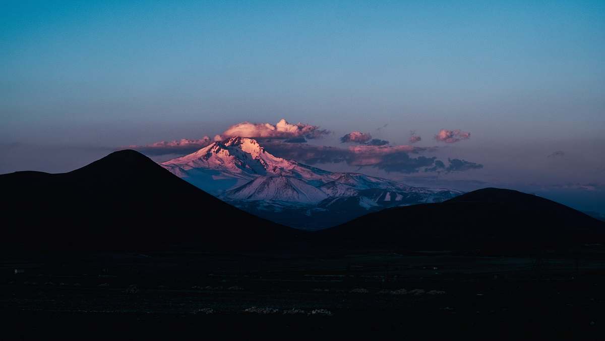 ridge aerial photo of mountains during daytime mountain range