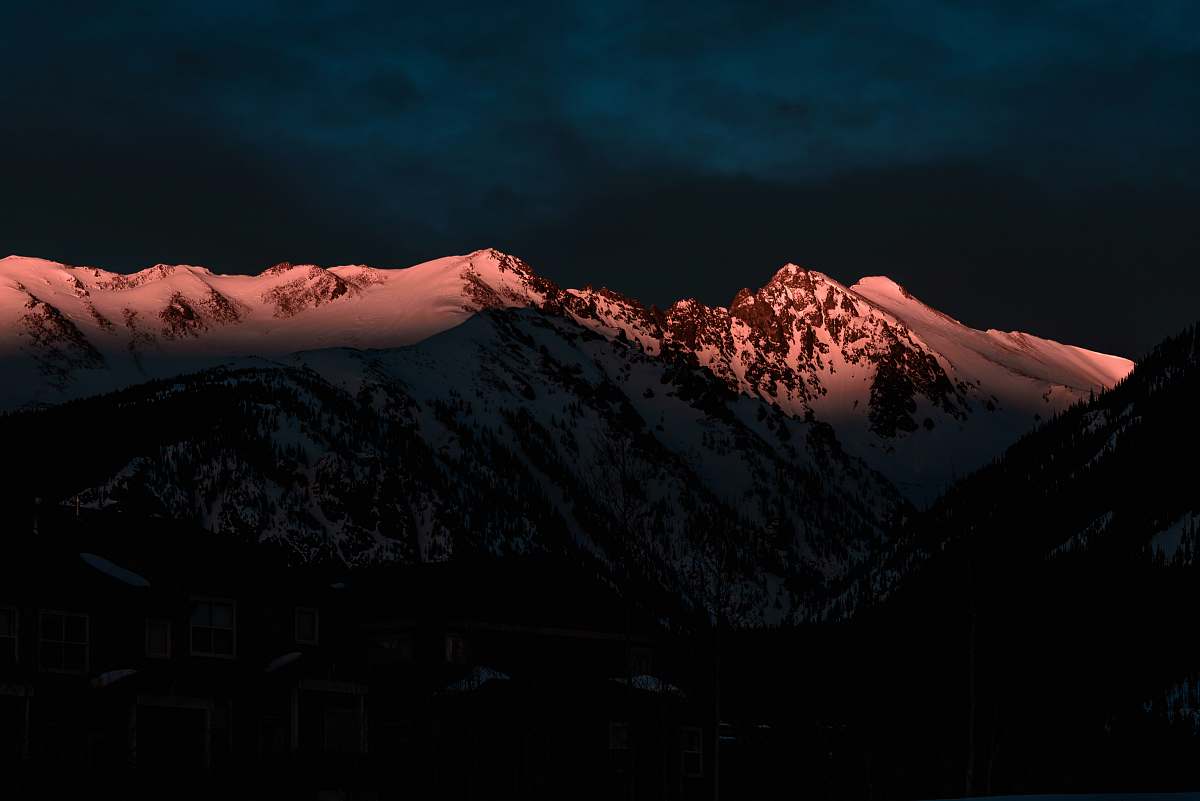 snow ice-capped mountain at night time sunlight