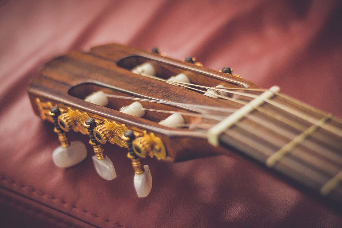guitar macro shot photography of brown classical guitar headstock instrument