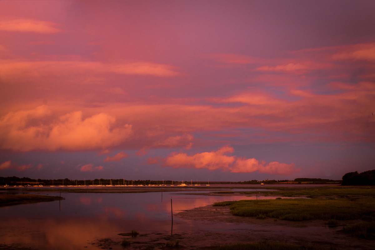 outdoors body of water under clouded sky during golden hour land