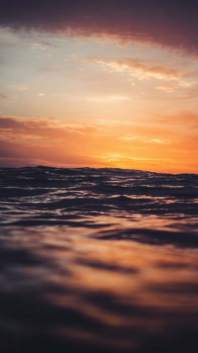 outdoors body of water under golden hour sky