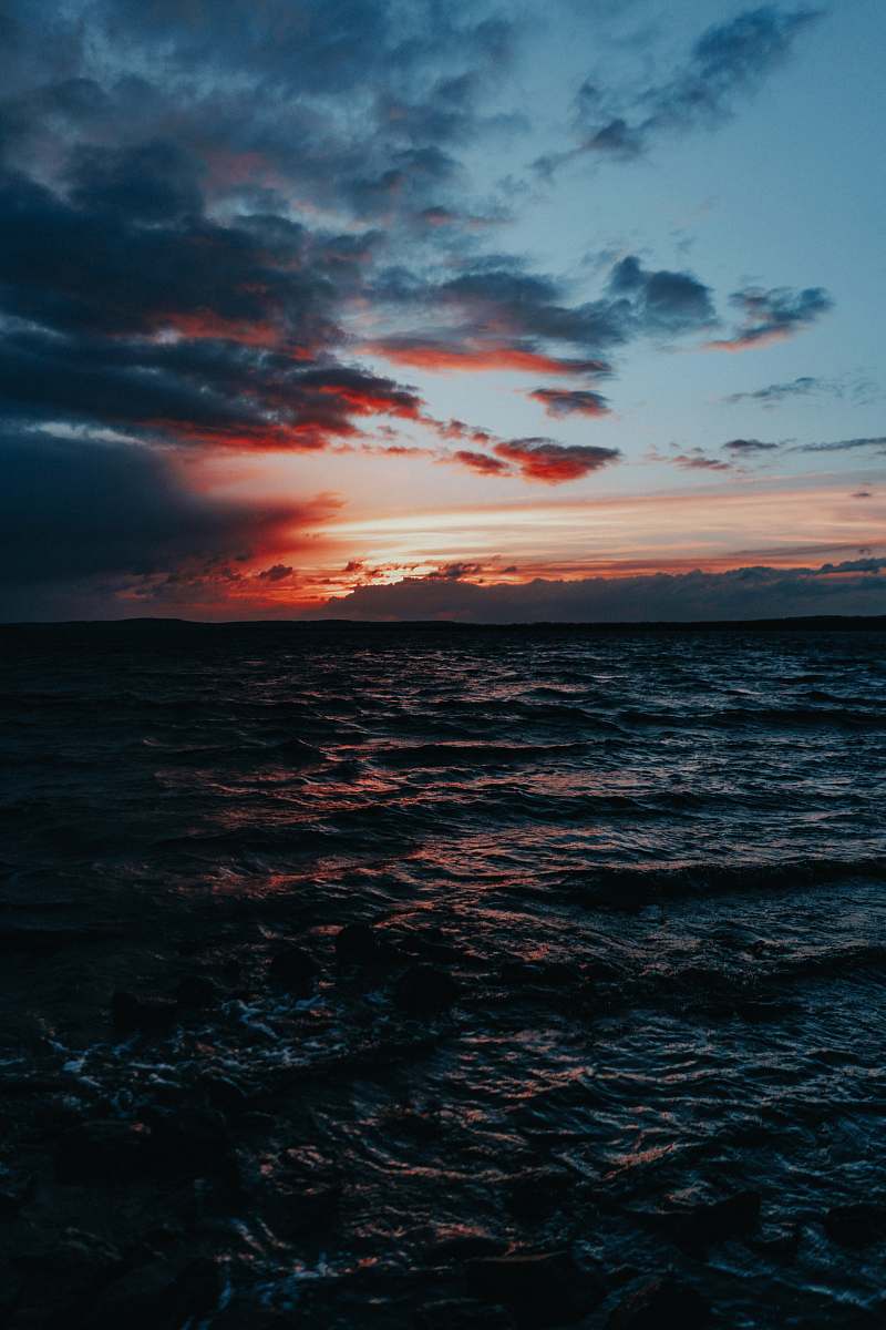 outdoors body of water under grey sky sunset