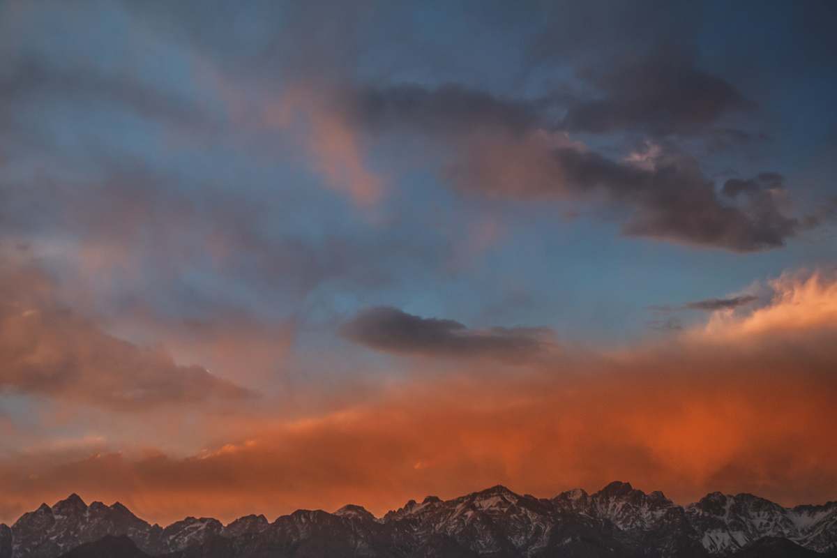 sunset gray mountain range during sunset sky