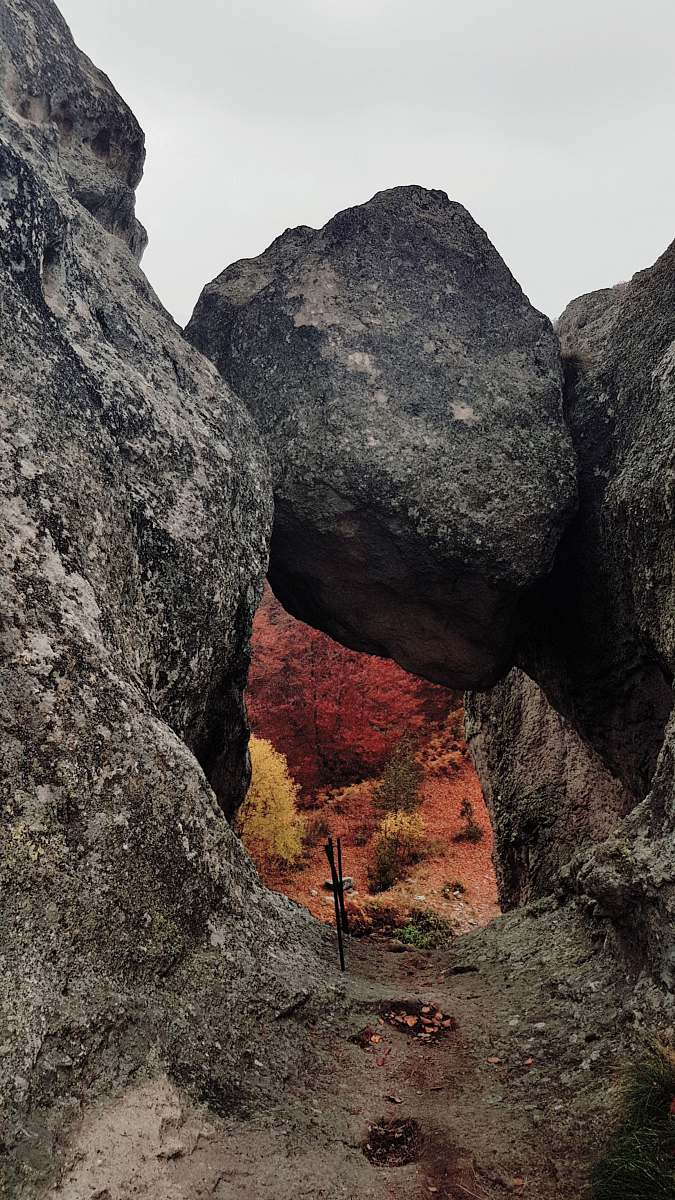 outdoors gray rock formation under white sky during daytime rock