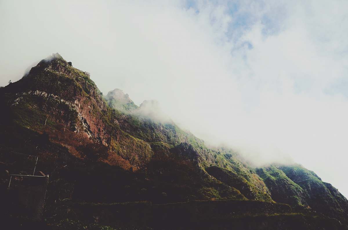 mountain mountain covered with clouds cliff