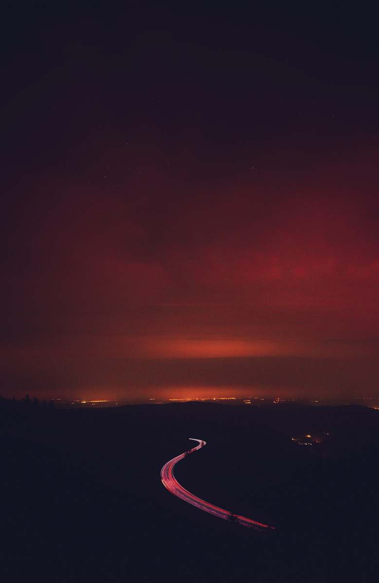 outdoors road under grey clouds sunset