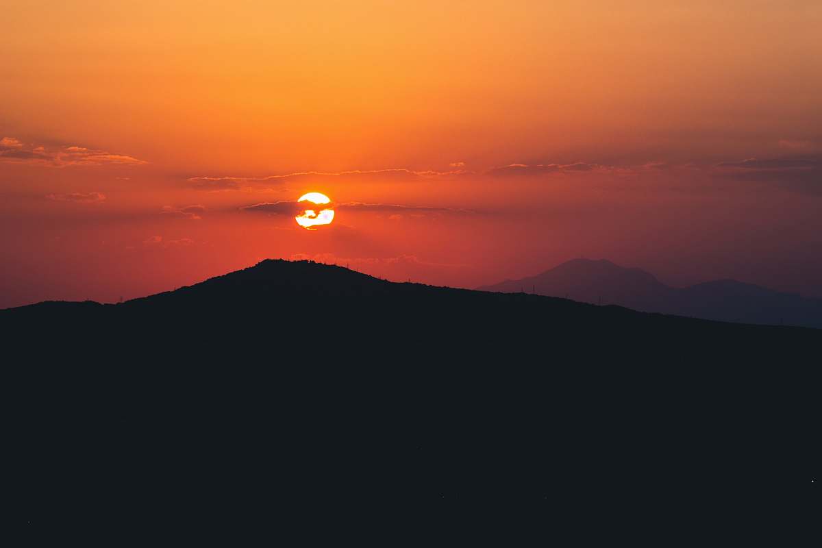 sunset silhouette of mountain during sunset outdoors