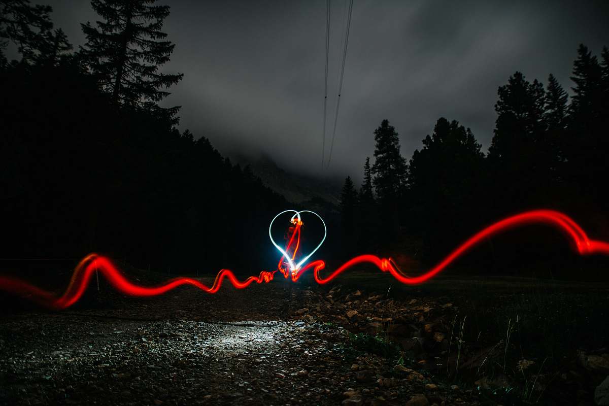 mountain timelapse of heart shape with silhouette of trees seceda
