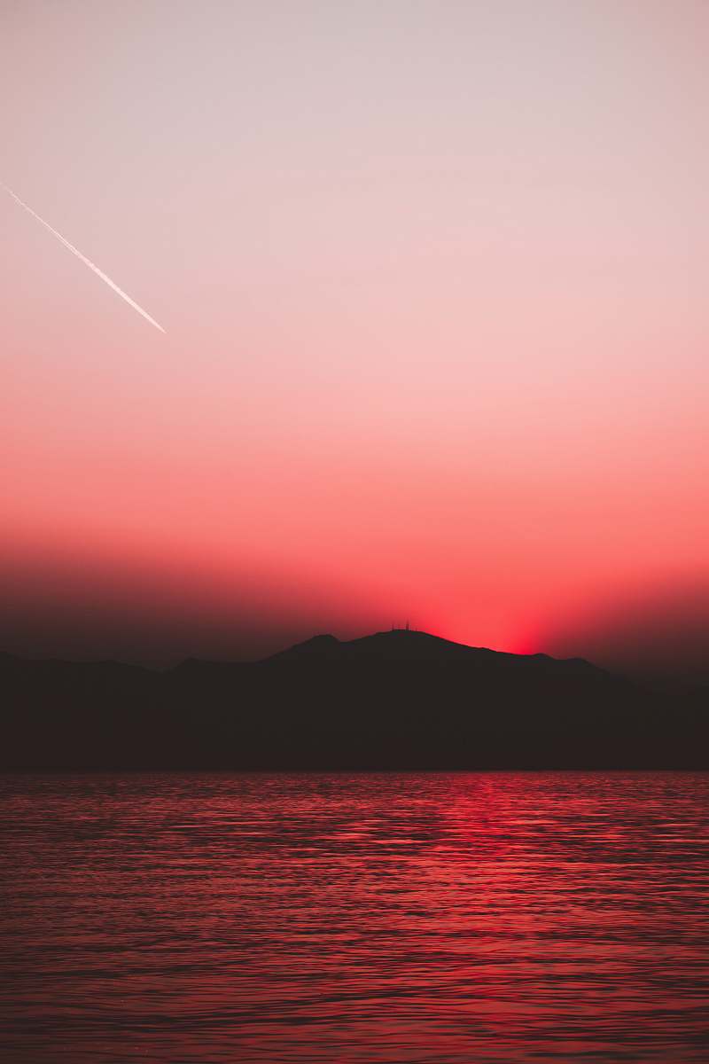 nature silhouette photography of body of water sky