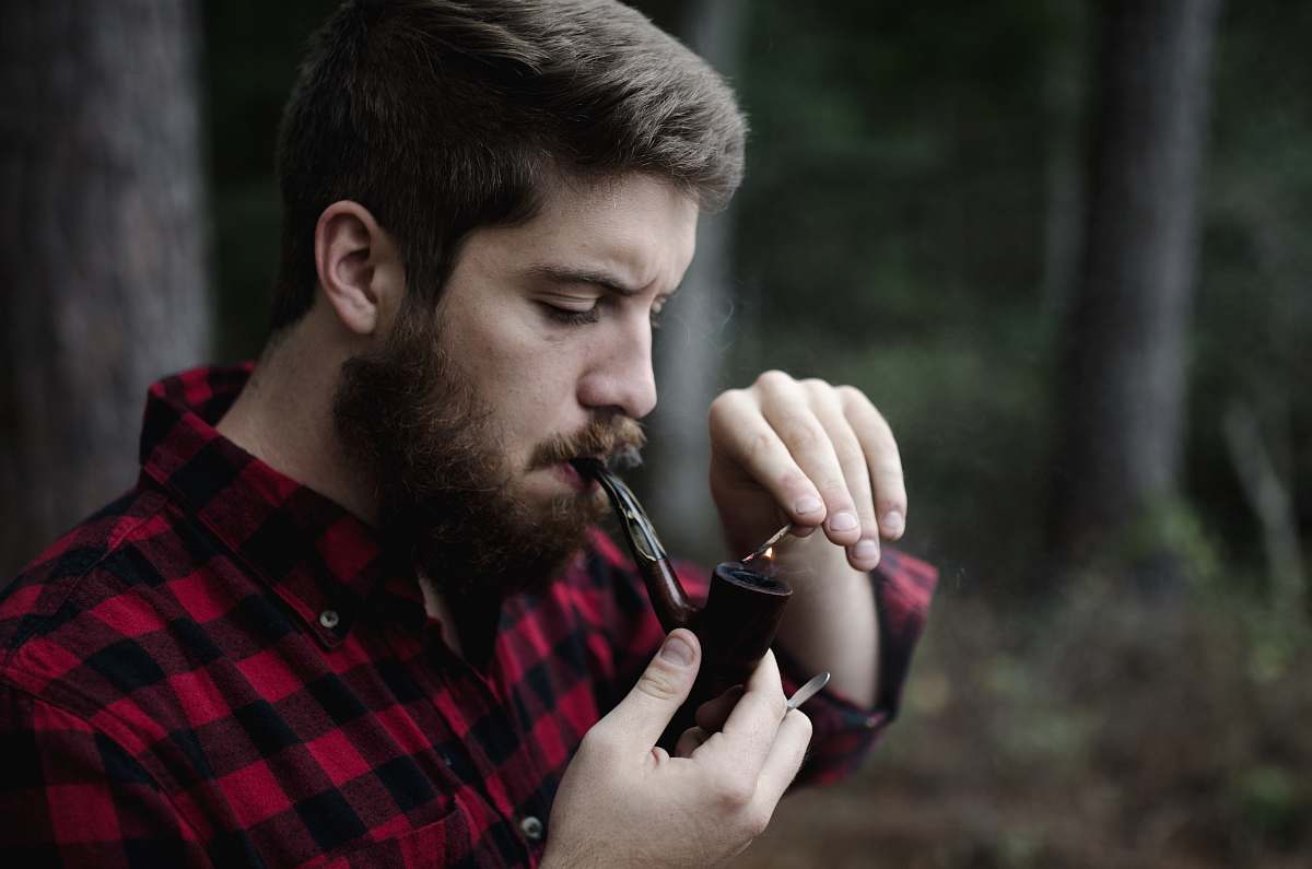 person man smoking smoking pipe human