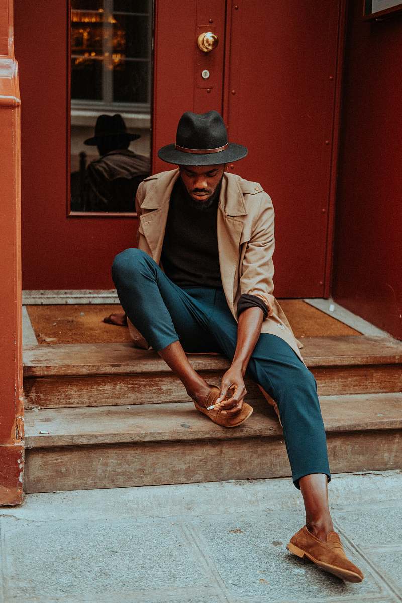 human man sitting on staircase people