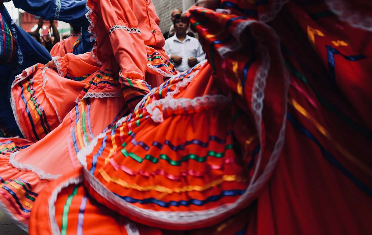 human man standing behind dancers people