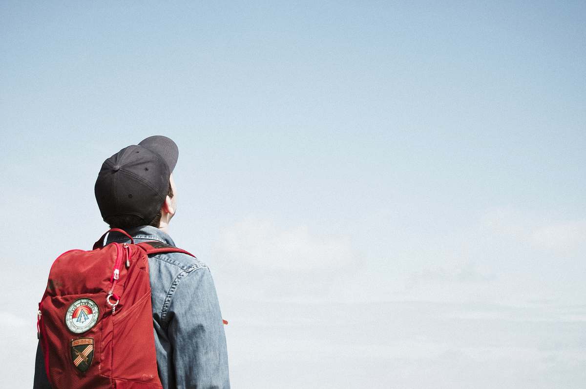 people man staring at white sky taken at daytime human