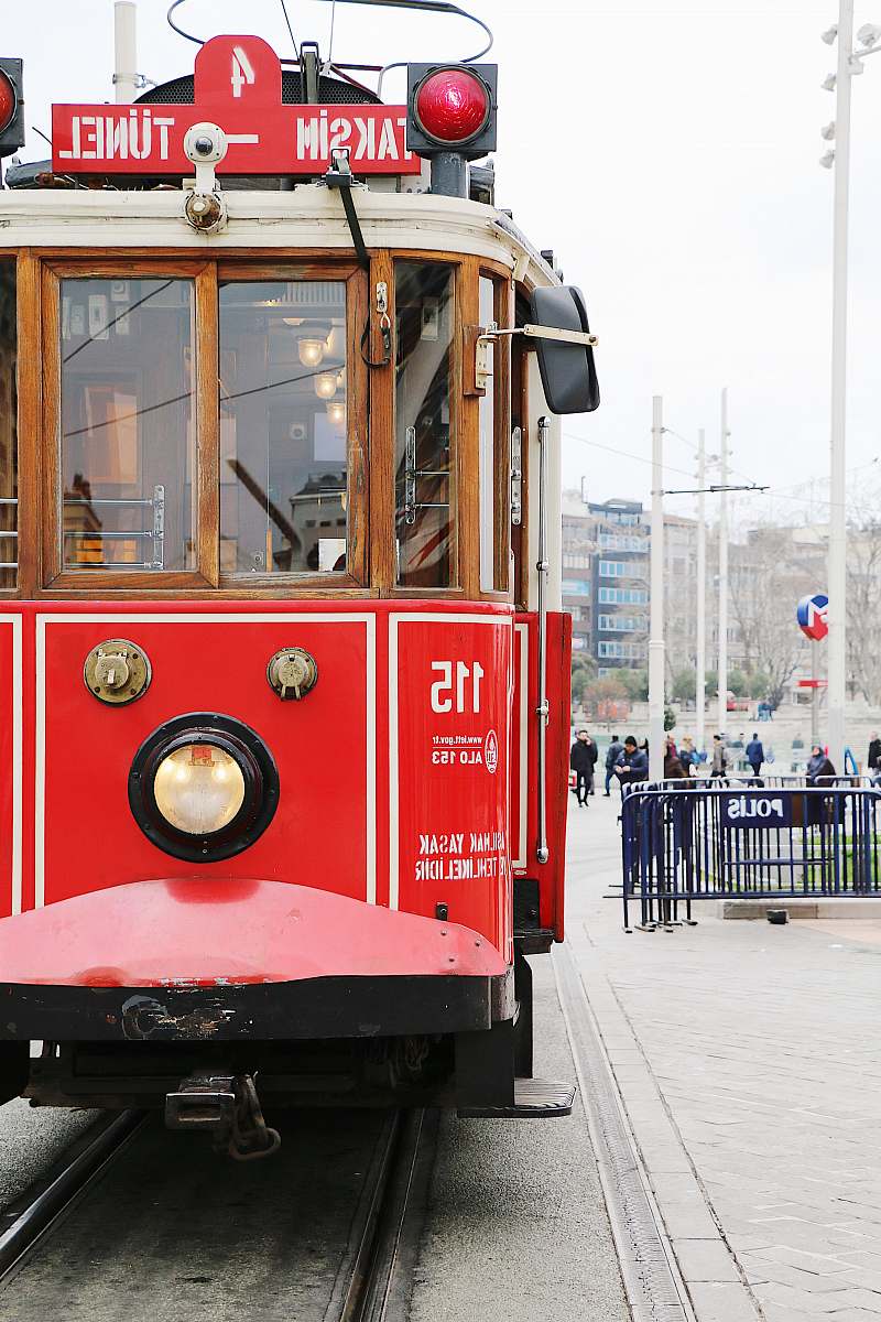 human red and brown train during daytime train
