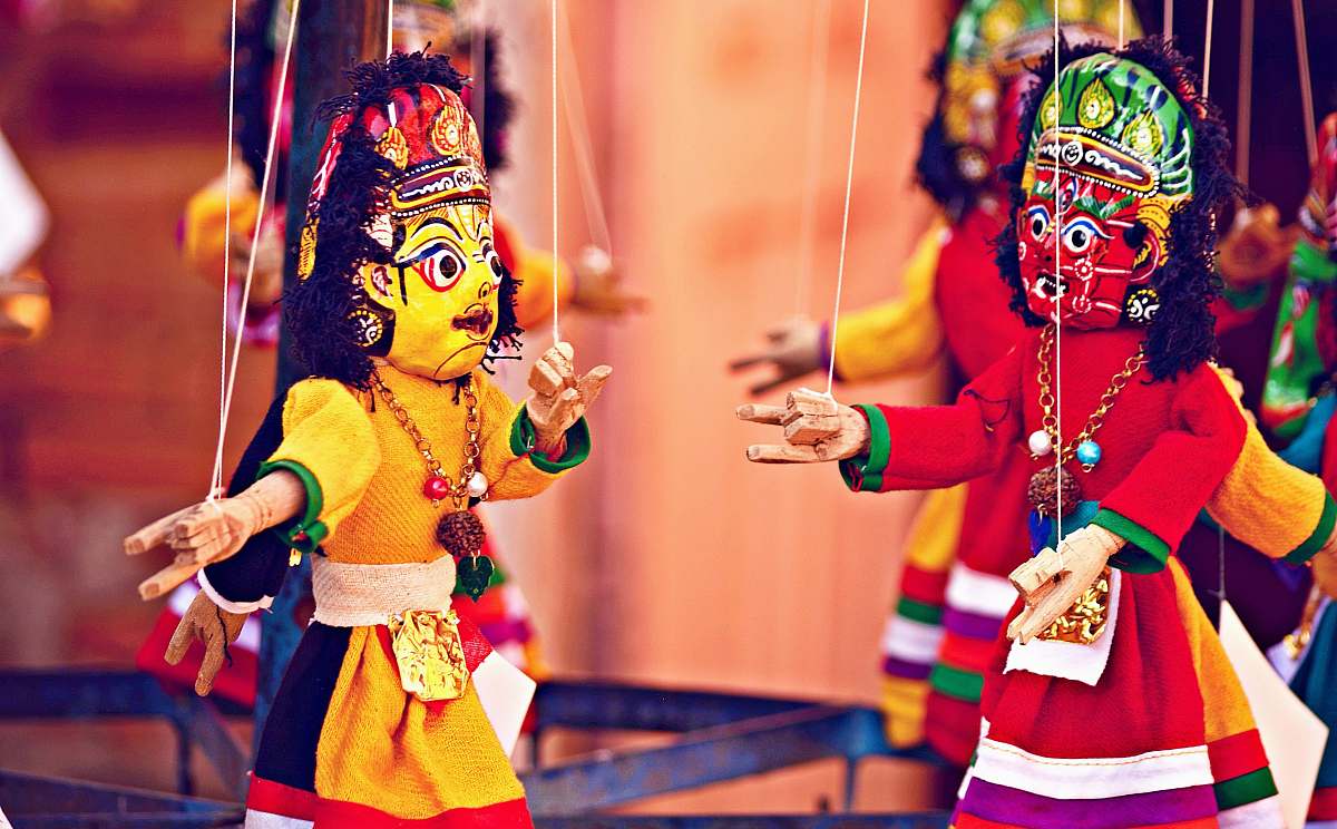 people selective focus photography of deity marionettes human