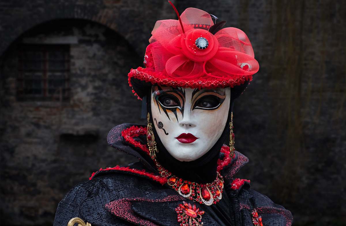 performer shallow focus photography of person in masquerade mask human