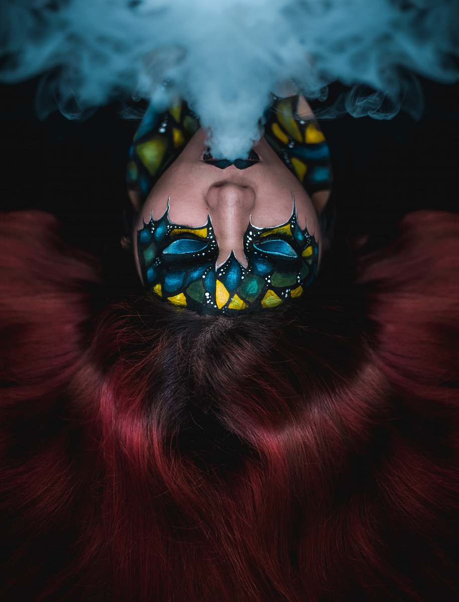 human woman blowing smoke people