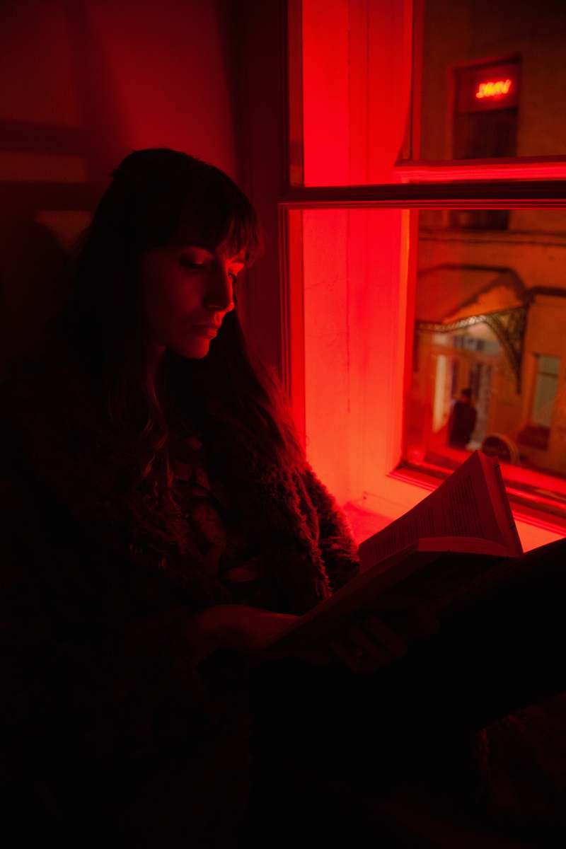 light woman sitting near window human