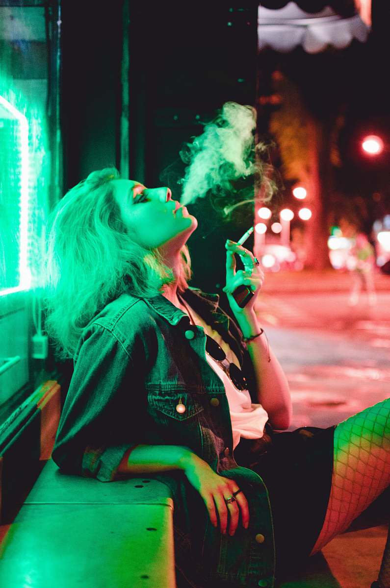 human woman smoking during nighttime smoke