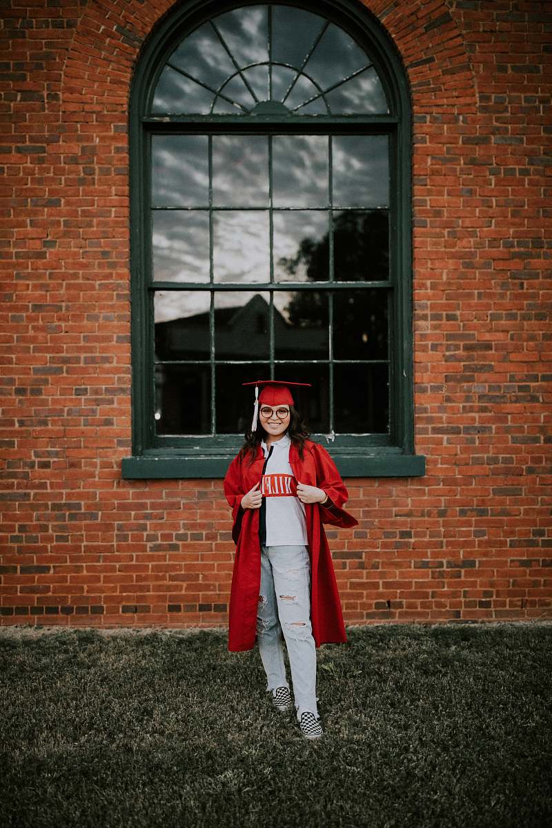 clothing woman wearing academic dress and hat coat