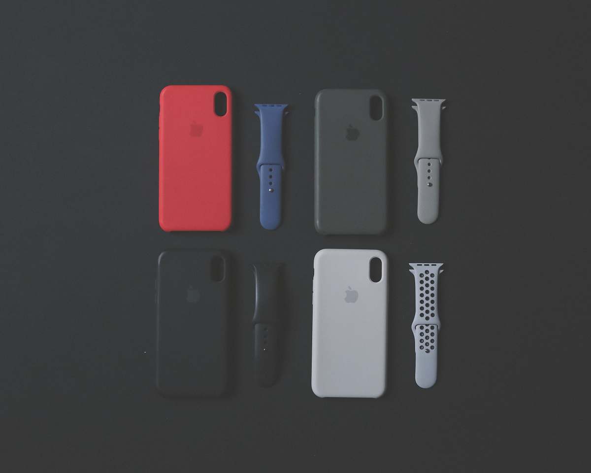 electronics four assorted-color iPhone Xs cases and sports bands mobile phone