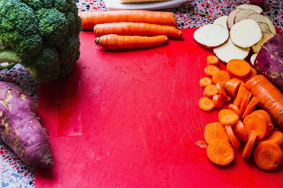 food sliced carrots on red board vegetable