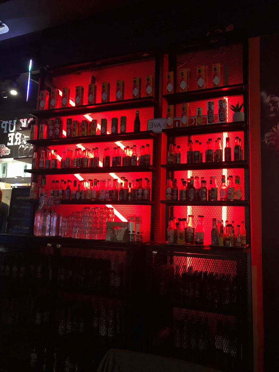 helsinki pile of liquor bottles in cabinet bar counter
