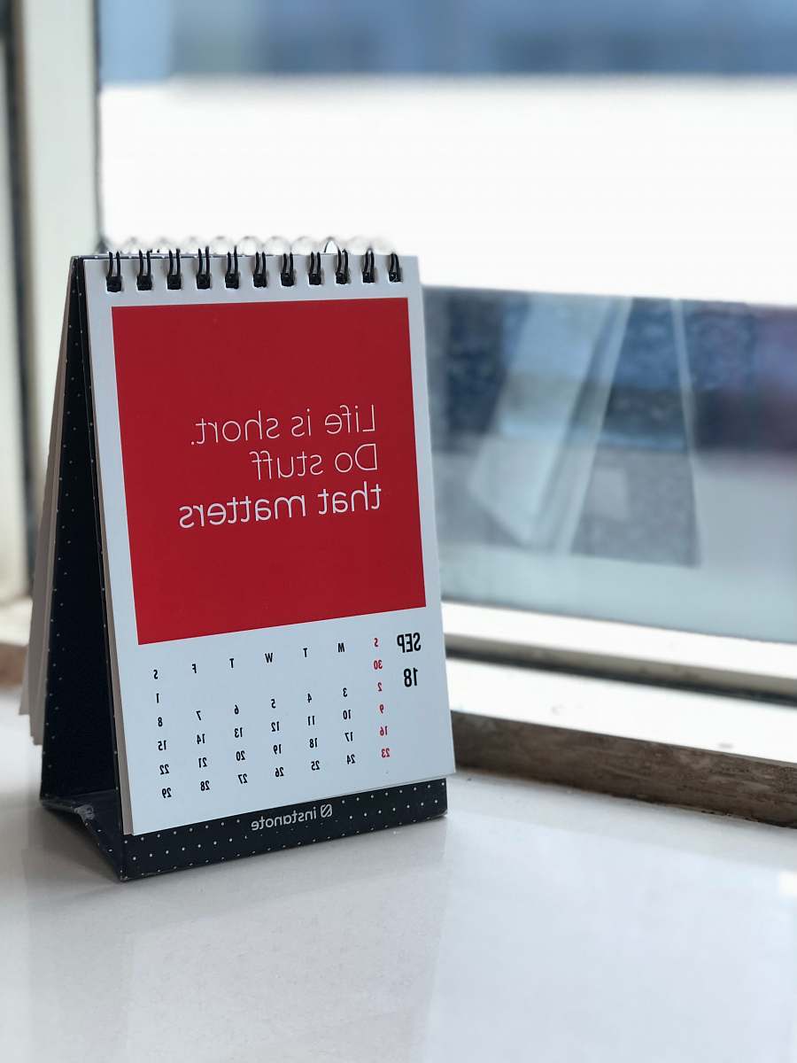 motivation spiral freestanding calendar on white surface dilkap chambers