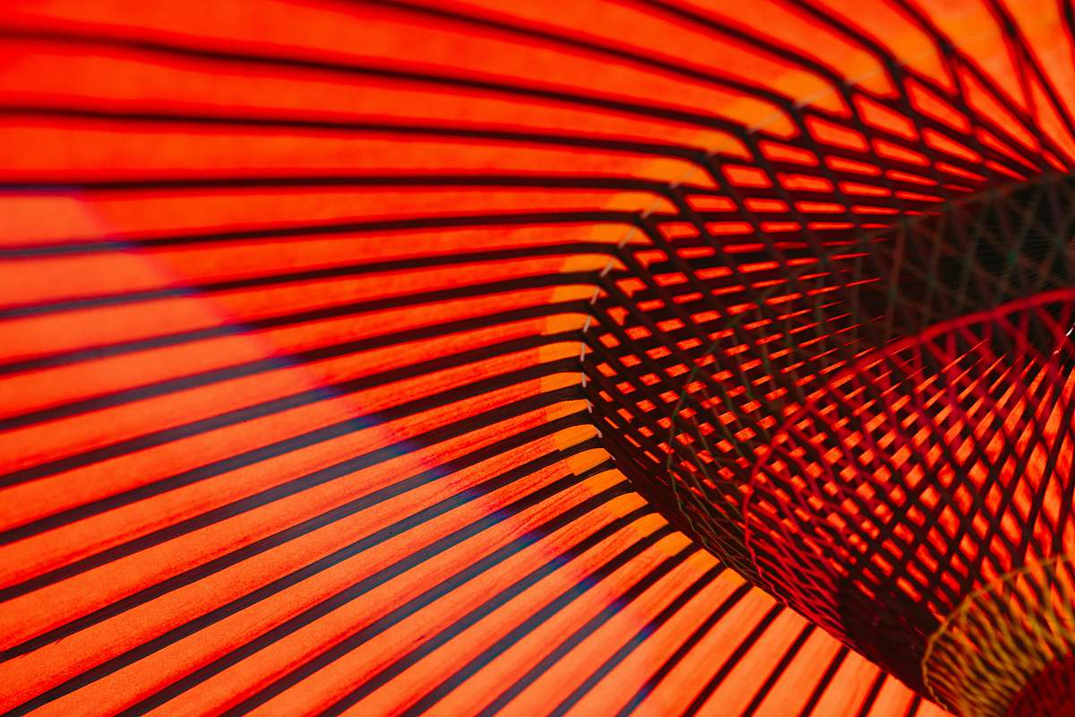 japan An abstract photo of orange neon lines and rails along the walls in an Asakusa building orange