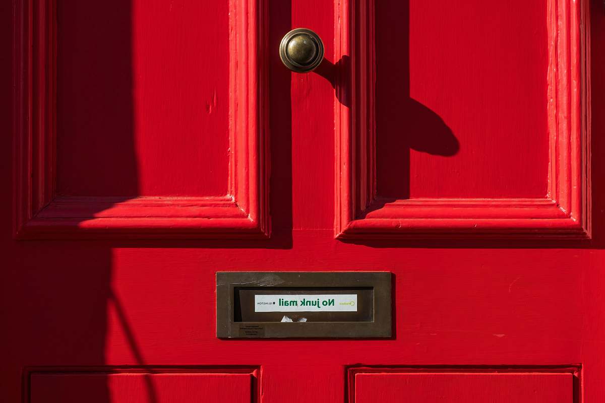 london closed red wooden door united kingdom