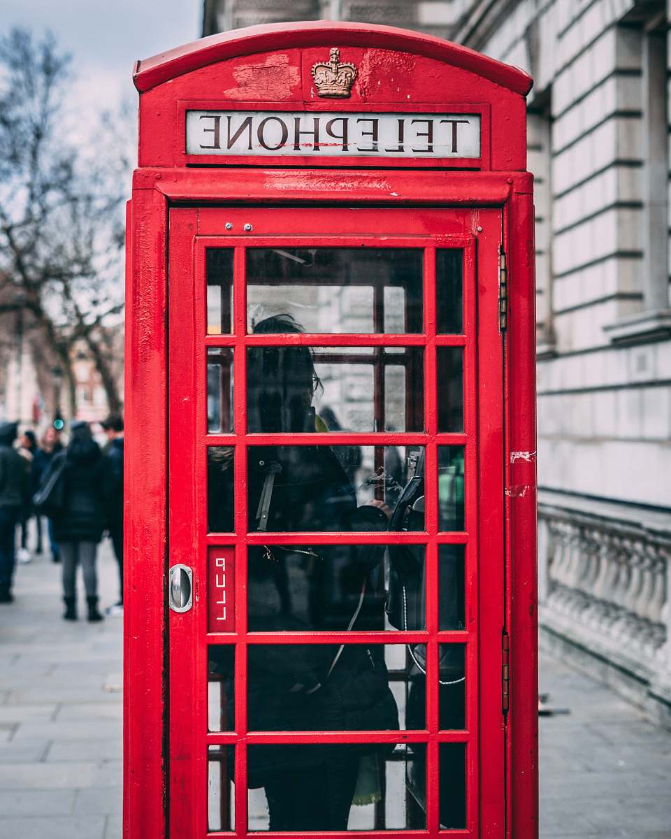 london closeup photo of red telephone booth phone booth