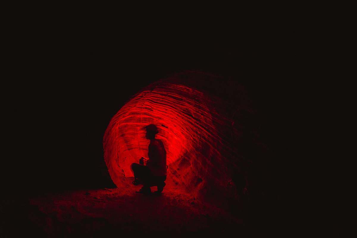 silhouette man in cave cave
