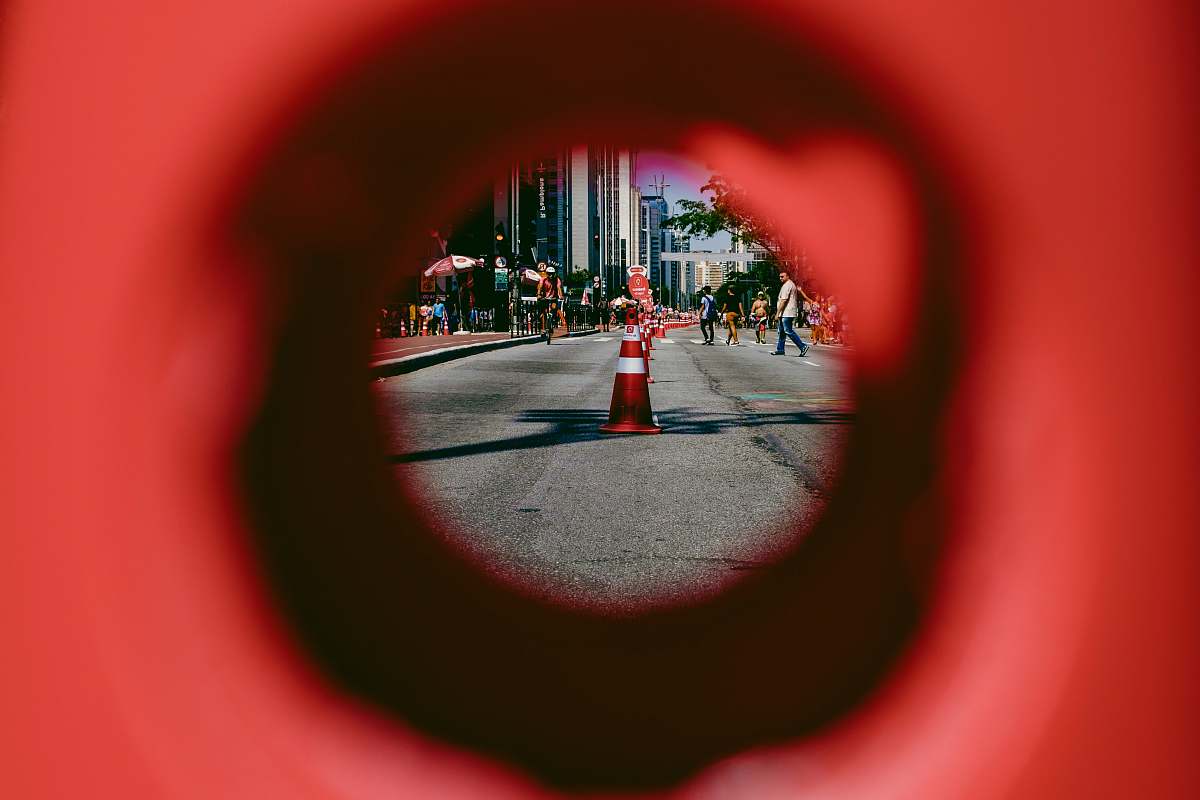 hole people walking near traffic cone on road during daytime paulista avenue