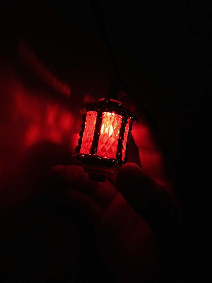 lantern person holding red light lamp