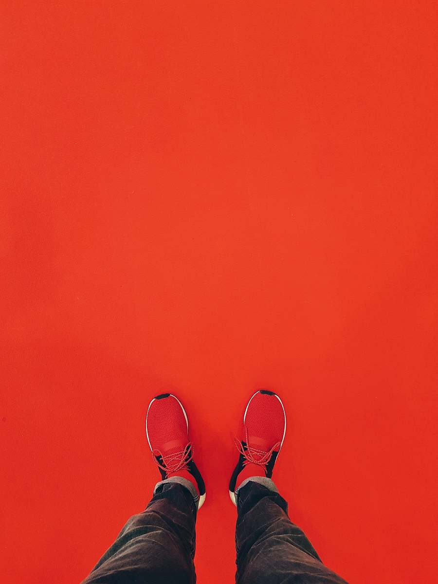 shoe person wearing red running shoe footwear