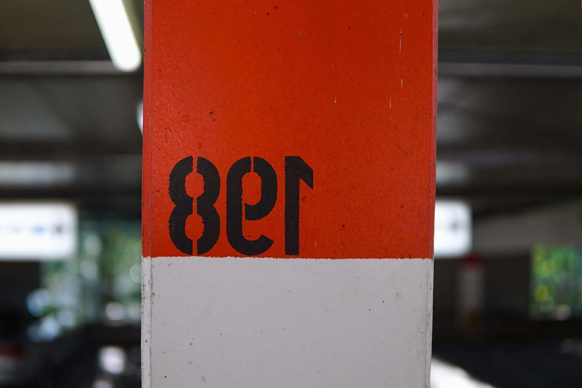 number post with painted 198 sign text