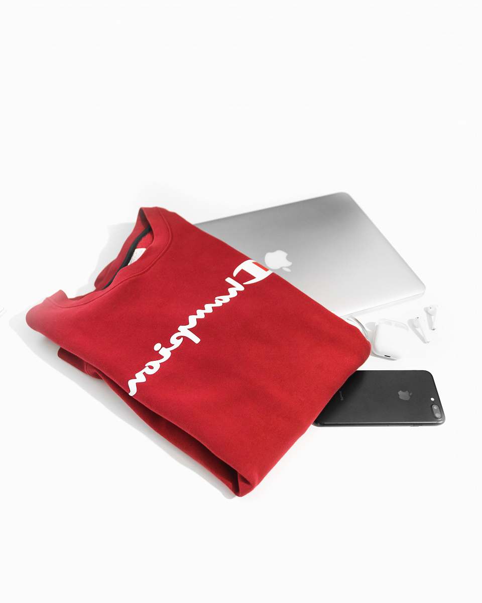 bag red and white Champion shirt on MacBook 