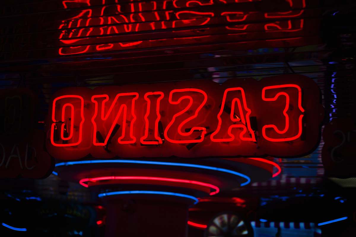 light red Casino neon sign turned on neon