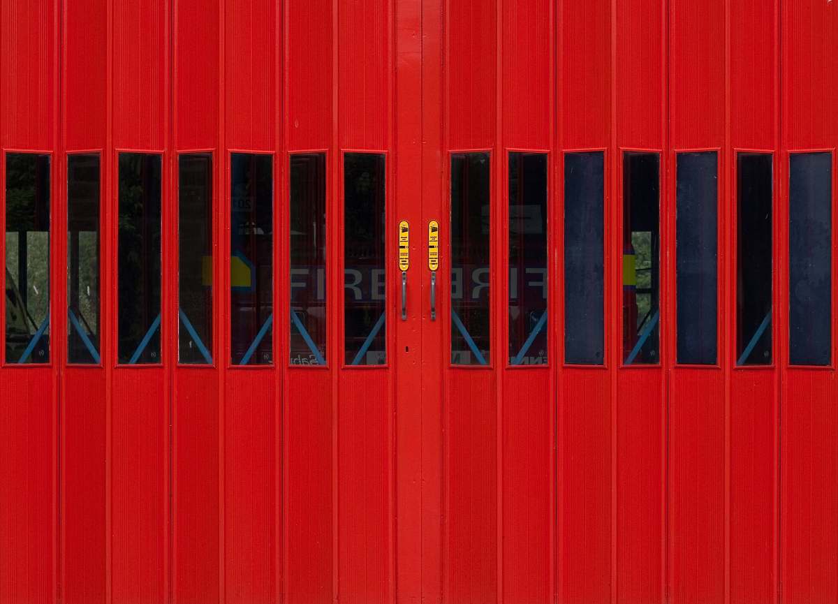 door red metal gate fire station