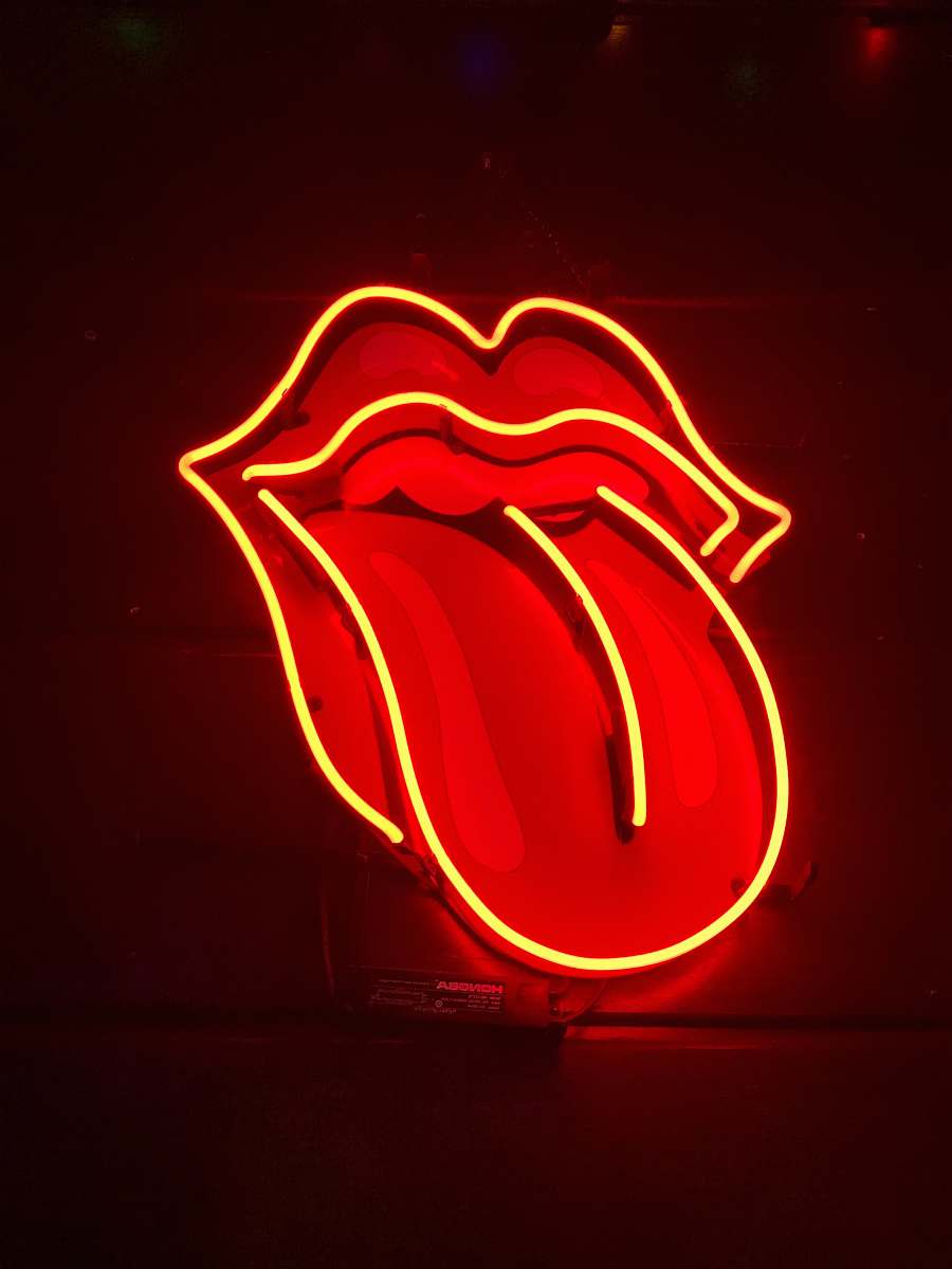 neon red tongue out neon light signage turned on light