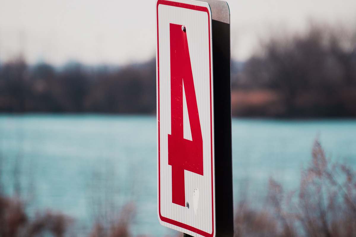 Sign White And Red Number 4 Signage In Shallow Focus Photography