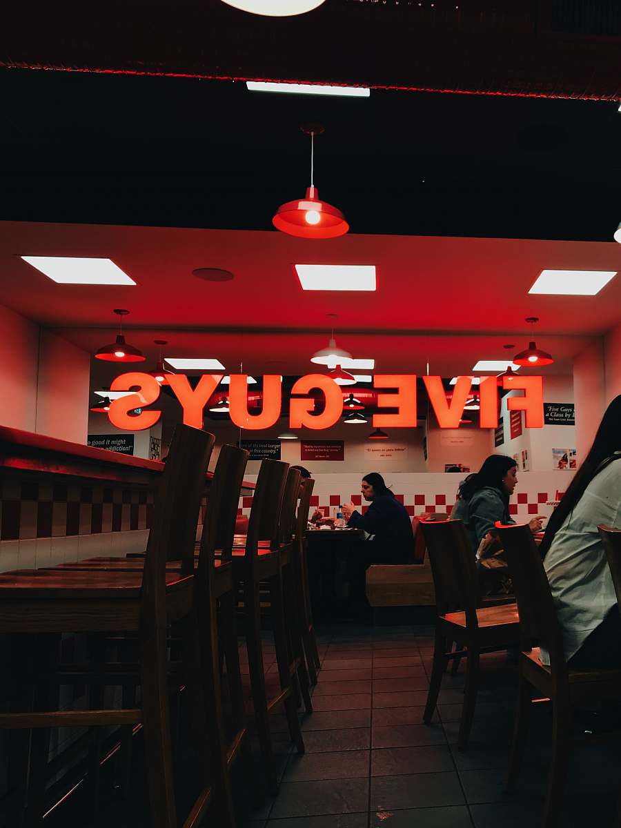 food brown wooden bar stools near bar table human
