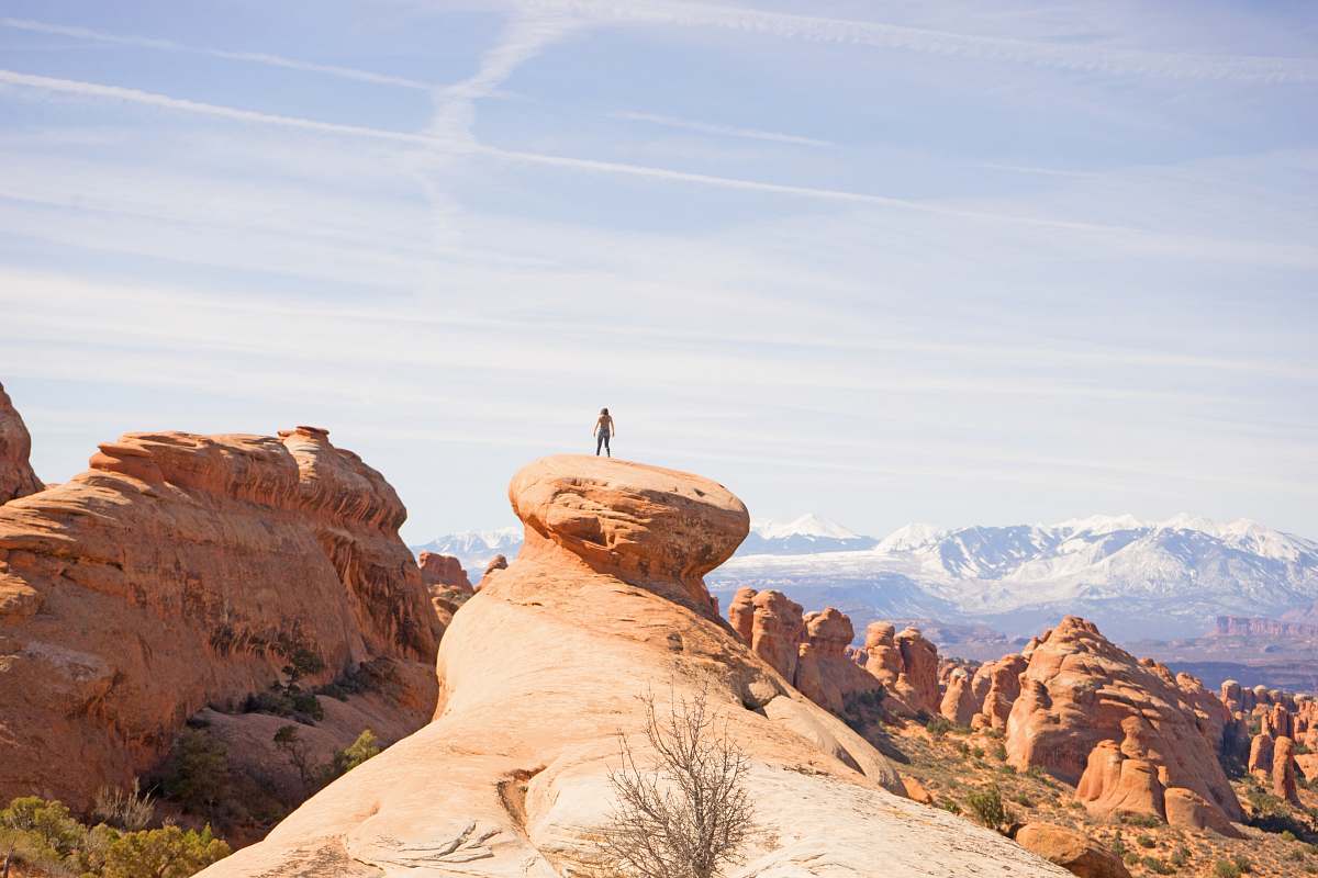 canyon person on top of canyon geological formation