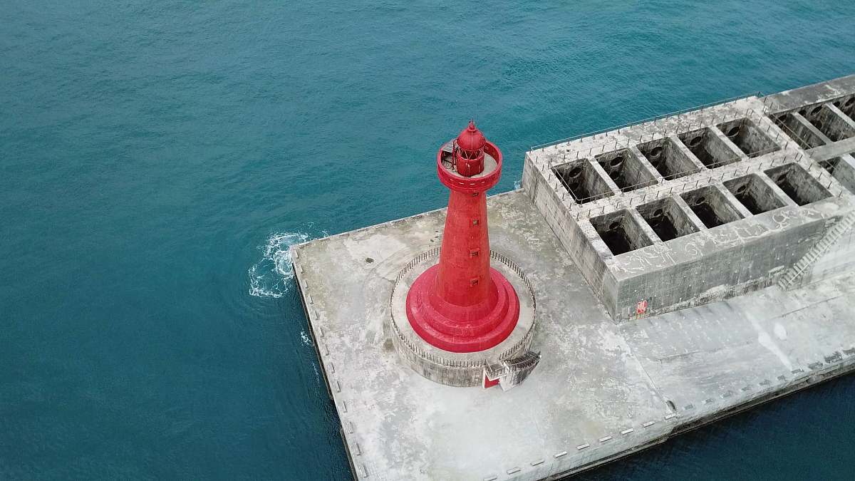ocean red lighthouse aerial view water