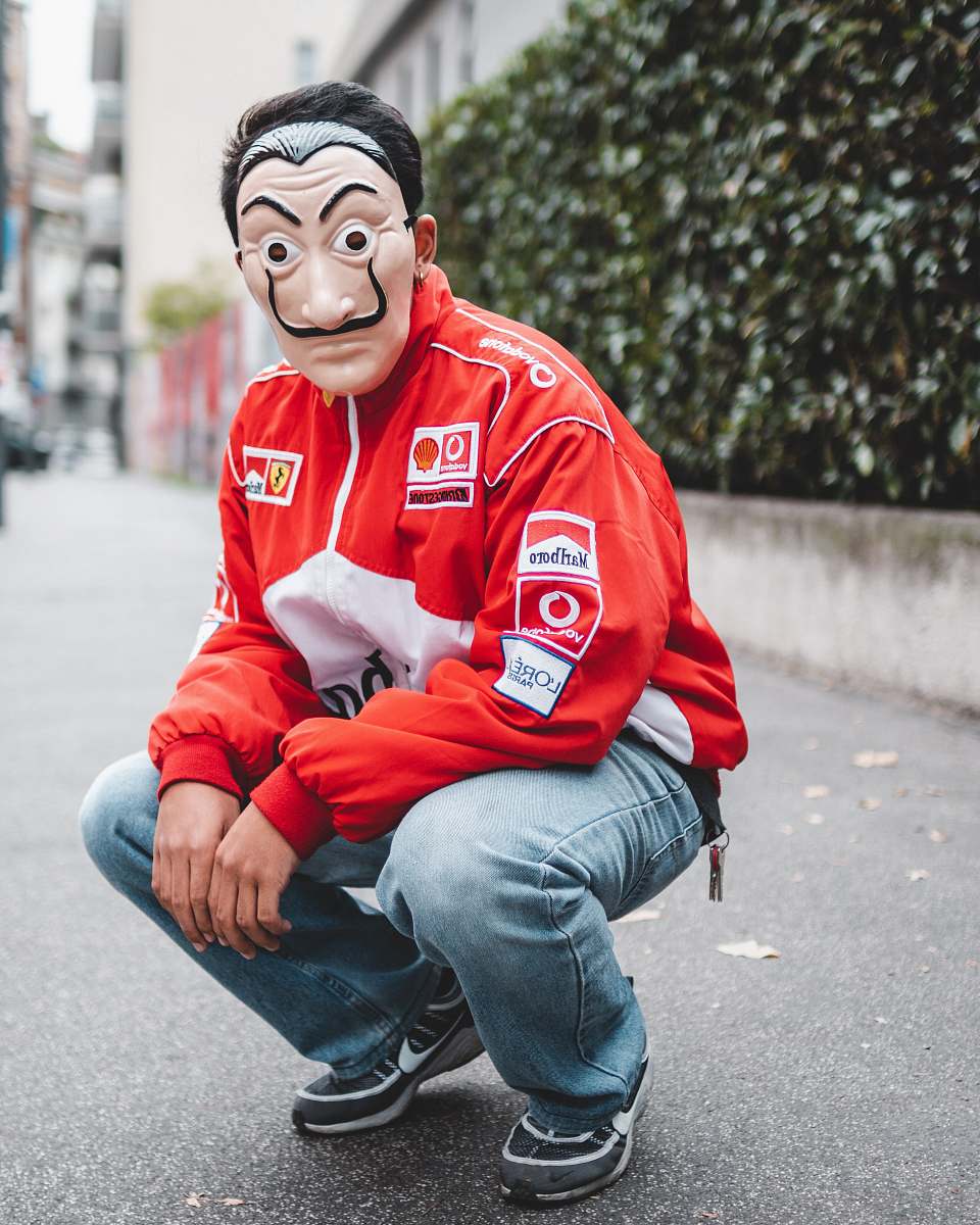 clothing selective focus photography of man wearing mask and red and white jacket apparel