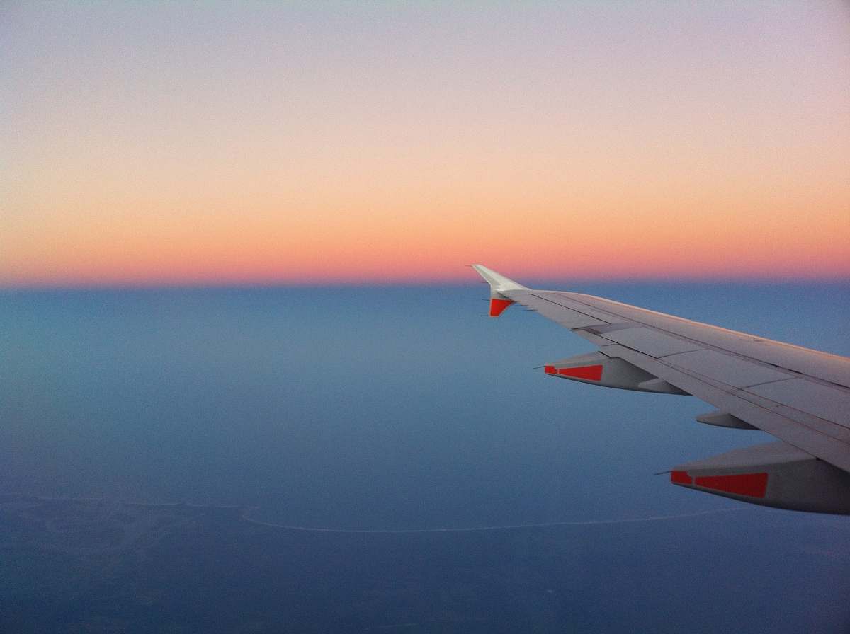 sunset airplane wing sunrise